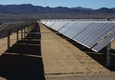 photovoltaic solar electric power plant with tracking panels in the desertの写真素材
