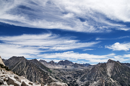 Sierra Nevada Mountain landscape looking over LeConte Canyon to Dusy Basin and the Palisades with feathery cloudsの写真素材