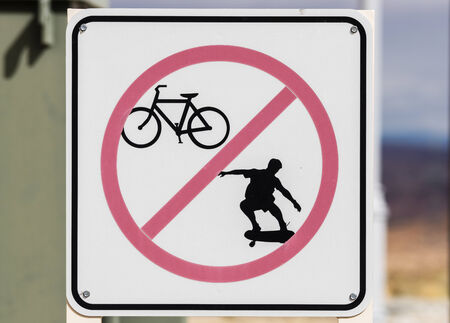 faded no biking or skateboarding sign の写真素材