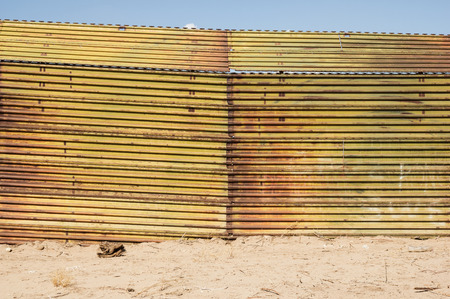 the United States border with Mexico near Algodones with a metal fence barrier