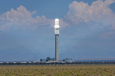 the Crescent Dunes concentrated solar power plant with heliostat mirrors focusing the solar energy...