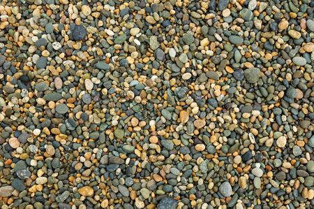 multi colored pebble background from beach in New Zealandの写真素材