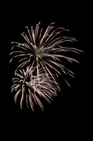 multiple fireworks explode with black backgroundの写真素材