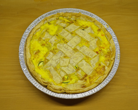 home made quiche in an aluminum pie tinの写真素材
