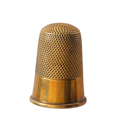 close up of brass thimble isolated on white backgroundの写真素材