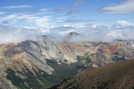 clouds part as a brief Colorado mountain storm clears awayの写真素材
