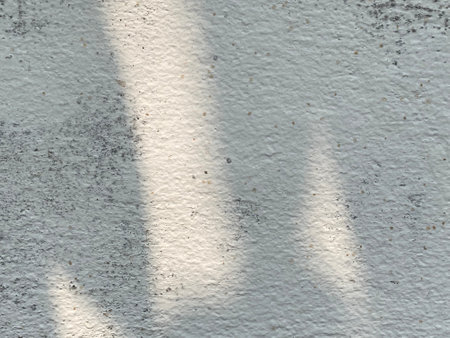 White concrete wall texture with shadows. Abstract background for design and ideas.の写真素材