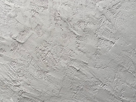 White plaster on the wall as a background. Texture of white plaster.の写真素材