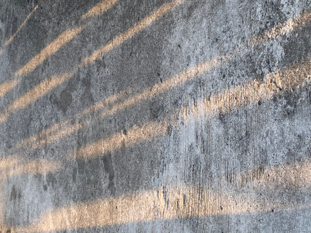 The shadow of the sun on the cement wall. Abstract background.