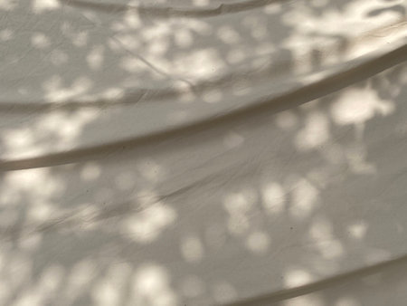 shadow on a white fabric, closeup of photo with soft focus