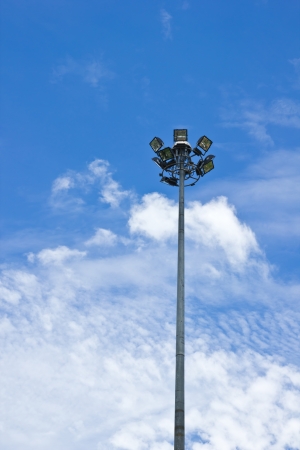 Spot-light tower in blue sky with cloundの写真素材