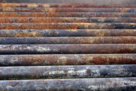 Rusted pipes of an old grilling pit photographed in mid afternoonの写真素材