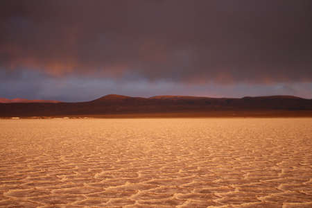 Storm at salt flat desert on sunsetの写真素材