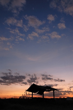 Sunset over hut ,Thailandの写真素材