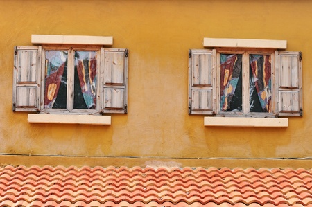 Vintage window on yellow cement wall can be used for backgroundのeditorial素材
