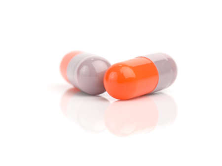 capsule pills isolated on white backgroundの写真素材
