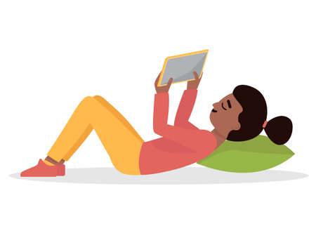 The girl lies on the floor and looks at the tablet.のイラスト素材