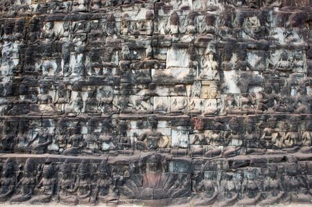 the old rilievo wall in ancient temple, Cambodiaの写真素材