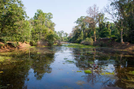 a river in front of Phnom Bakheng in Cambodiaの写真素材
