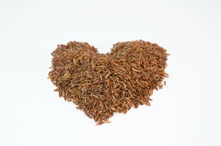 brown rice in a coconut bowlの写真素材