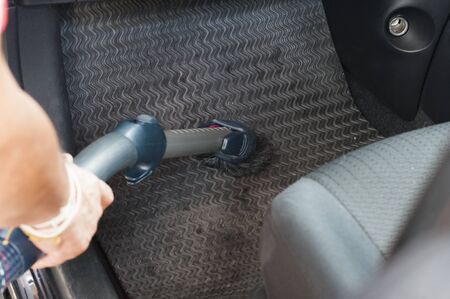 cleanning a car by using vacuum cleannerの写真素材