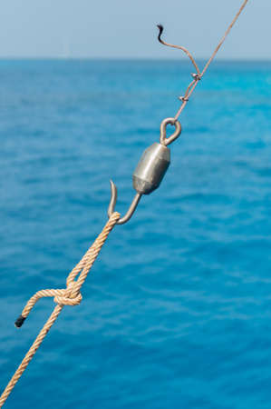 fishing hook, tool in a boat