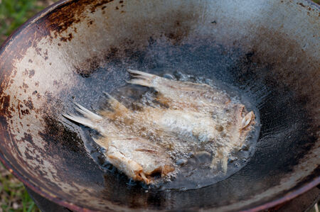 closed up fried fish on stove, thai local lifeの写真素材