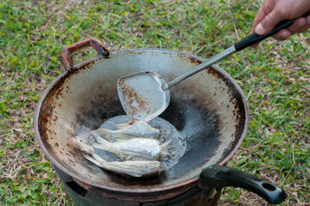 closed up fried fish on stove, thai local lifeの写真素材