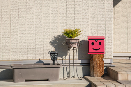 closed up the red mailbox and pots at home in Japanの写真素材