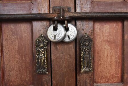 closed up the local master key on wood wall in Nepalの写真素材