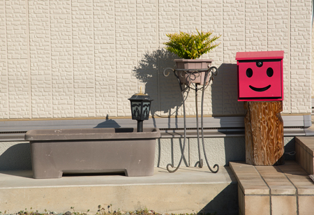 closed up the red mailbox and pots at home in Japanの写真素材
