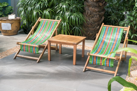 view of deckchairs in the gardenの写真素材