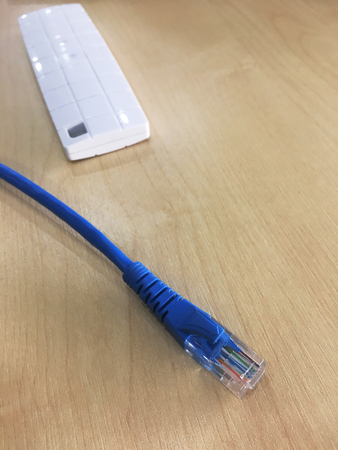 closed up the LAN cable on a tableの写真素材