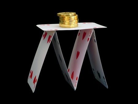 House of cards with gold coins on black background