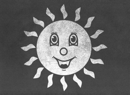 Happy smiling sun on chalkboardの写真素材