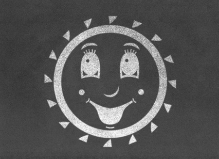 Happy smiling sun on chalkboardの写真素材
