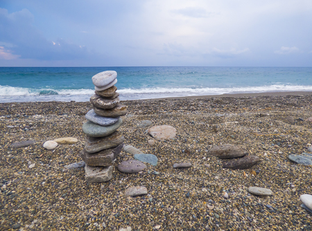 Stone pyramid on beachの写真素材