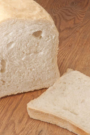 Appetizing home-made bread on wooden table.の写真素材