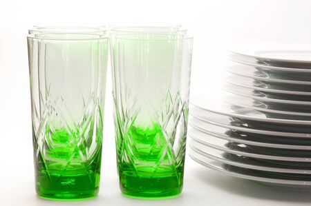 Green glasses and white platesの写真素材