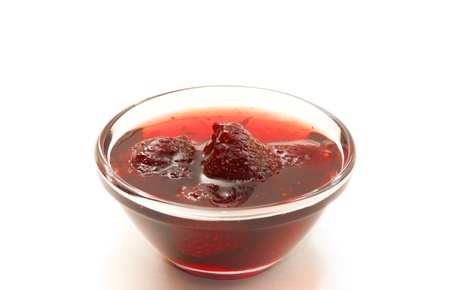 Appetizing jam with whole berries isolated on white. の写真素材