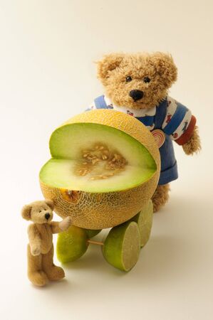 Fruit fancy. Melon buggy and teddy bears.の写真素材