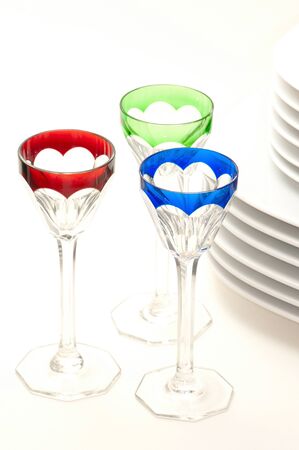 Beautiful wine glasses and white platesの写真素材