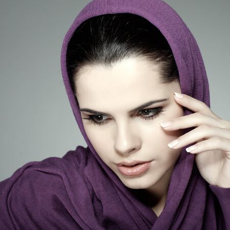 A beautiful young woman is in red clothesの写真素材