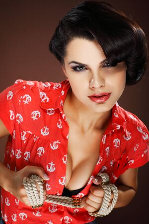 A photo of beautiful brunette is in style of pinup, glamurの写真素材