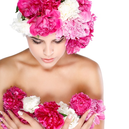 beautiful young girl with pink flowersの写真素材