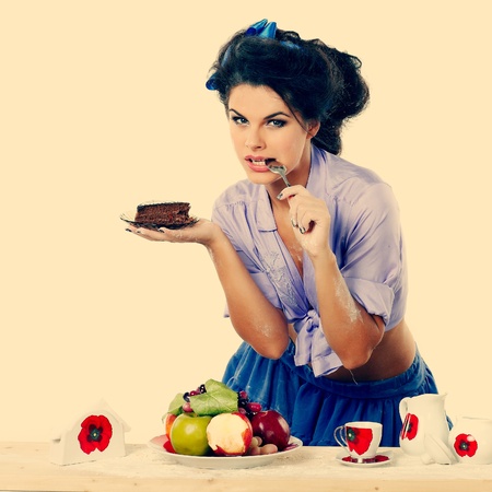 Photo of beautiful sexual brunette on a kitchen in style of pinapの写真素材