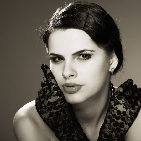 A beautiful young woman is in red clothesの写真素材