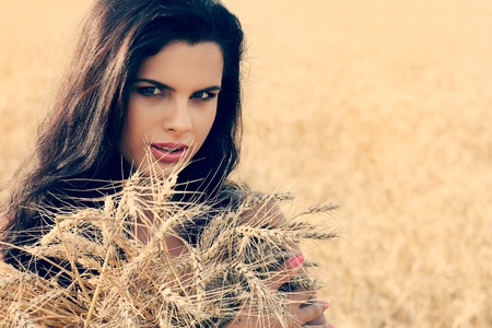 A beautiful  girl is in the fieldの写真素材