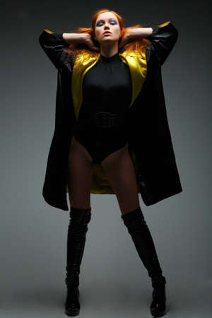 A beautiful young woman is in dark  clothesの写真素材