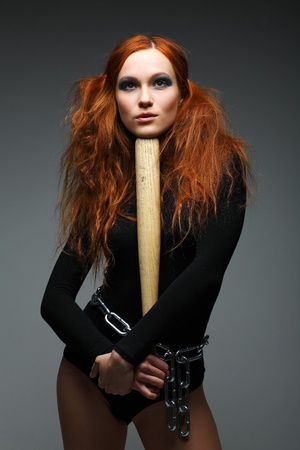 A beautiful young woman is in dark  clothesの写真素材